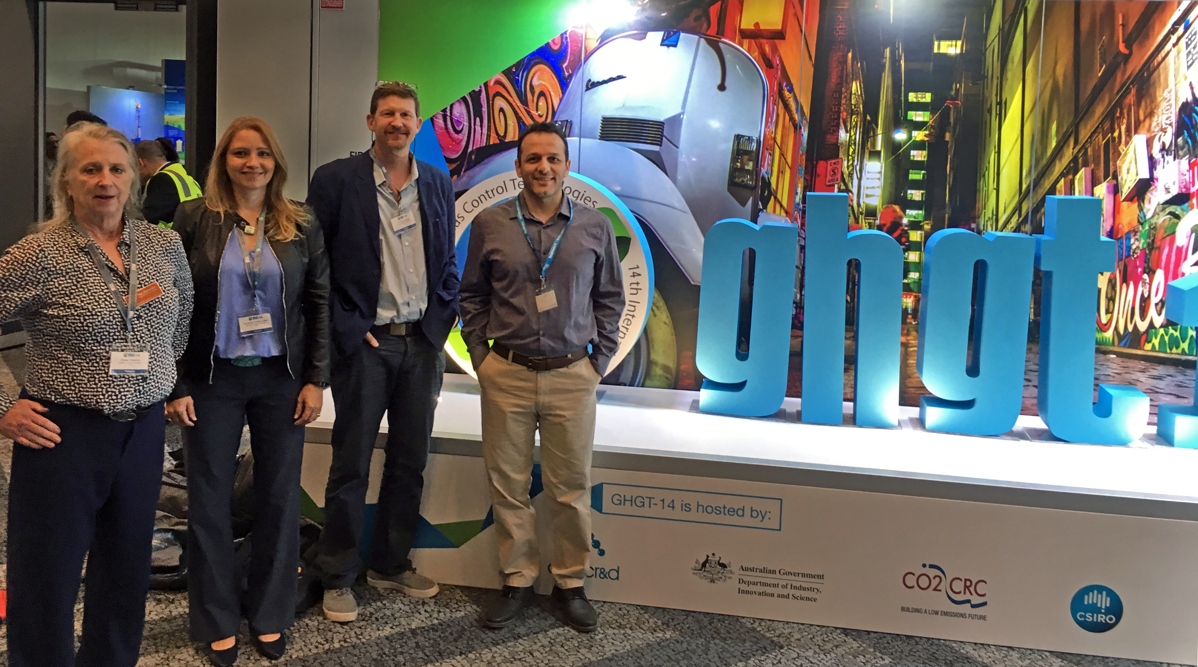GCCC researchers stand in front of the ghgt-14 conference sign