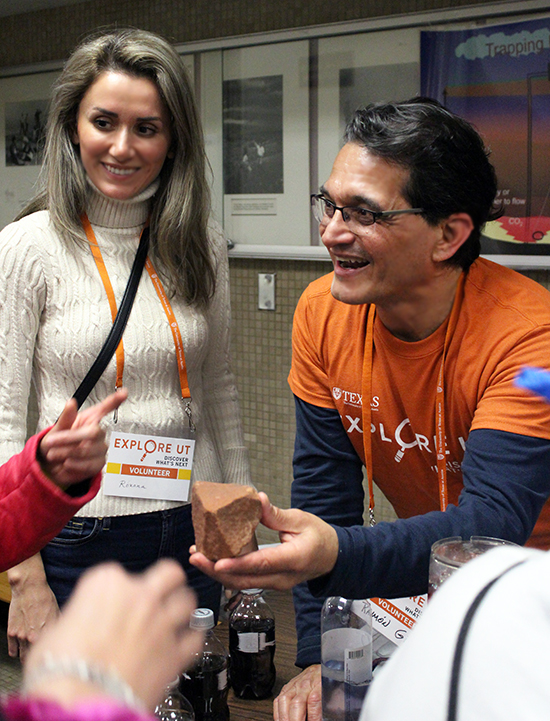 Roxana Darvari and Ramon Gil-Egui present a hands-on demo and show students what sandstone rocks look like and how they absorb fluids like water