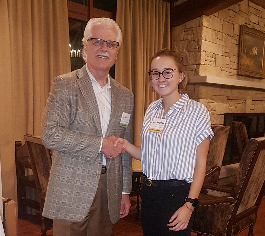 margaret shakes hand with award presenter